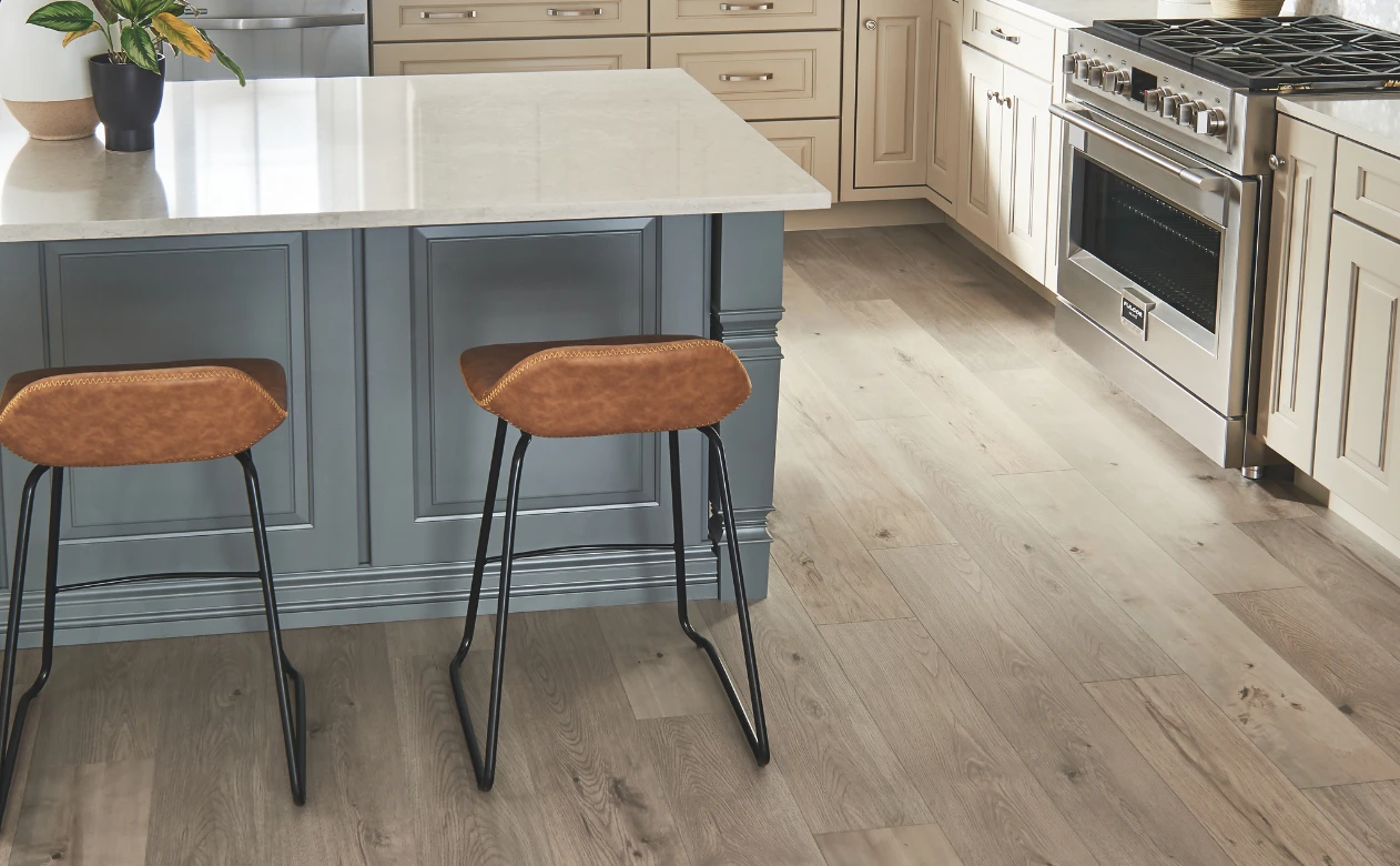 laminate flooring in kitchen with blue island