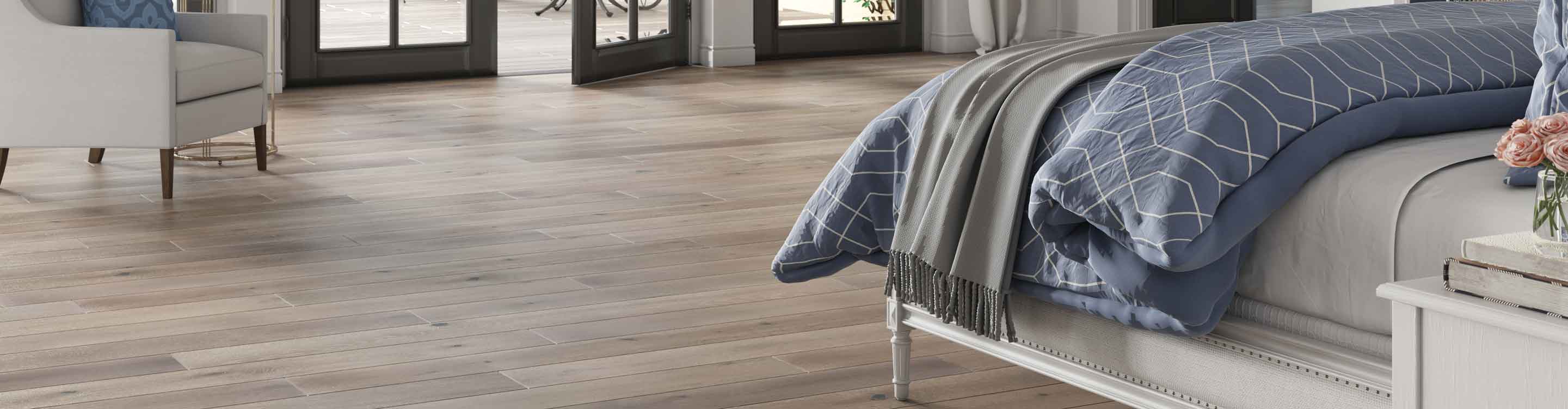 Ash brown hardwood floors in a bedroom with a fireplace