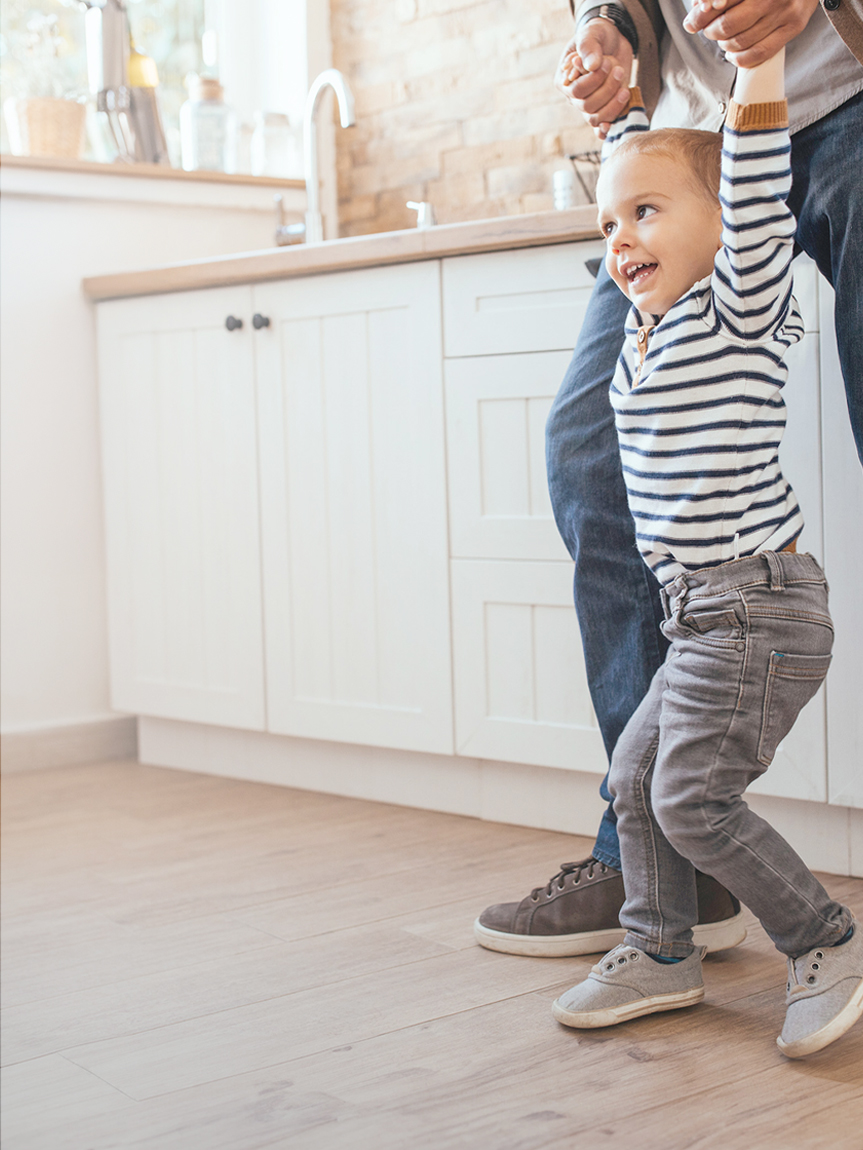 Child Walking on Hardwood Floor