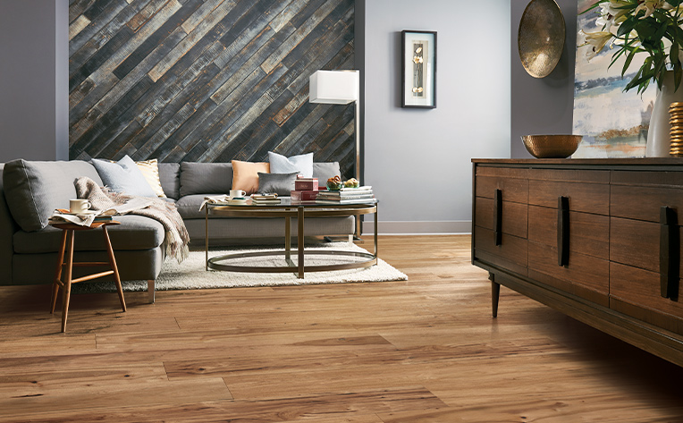 white area rug in living room with hardwood floors